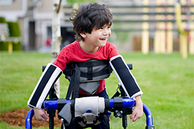 Child with Mobility Aid and Adaptive Equipment